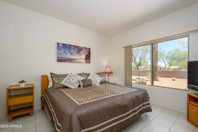 16354 W Labyrinth Ln, Surprise, AZ 85374 - tiled bedroom featuring baseboards