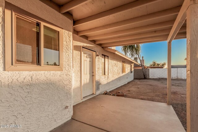 view of patio / terrace featuring fence