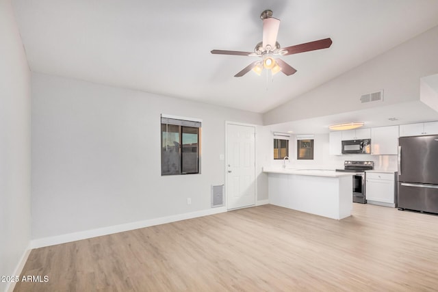 unfurnished living room with light wood-style flooring, lofted ceiling, baseboards, and ceiling fan