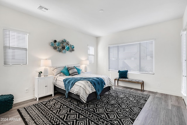 bedroom featuring wood-type flooring