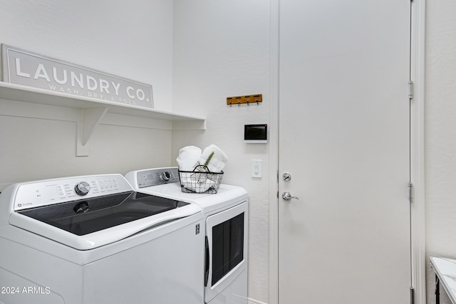 laundry room featuring washing machine and clothes dryer