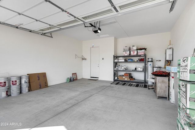 garage featuring a garage door opener and secured water heater