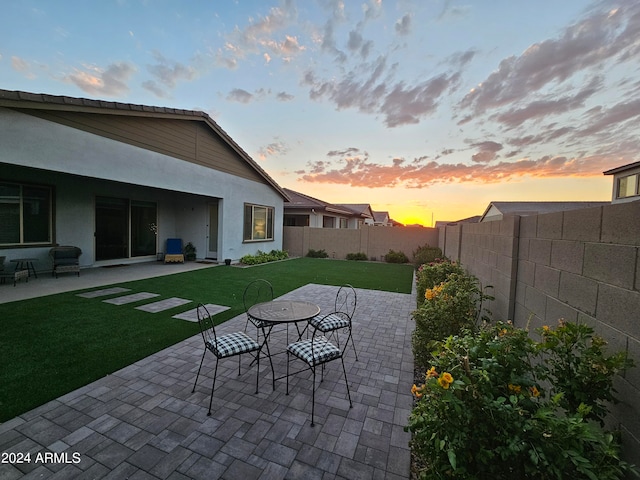 patio terrace at dusk with a yard