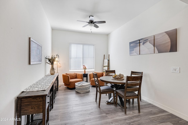 dining space featuring ceiling fan and hardwood / wood-style floors