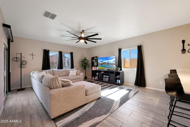 12731 W Myrtle Ave, Glendale, AZ 85307 - living room featuring healthy amount of natural light, a ceiling fan, and wood finish floors