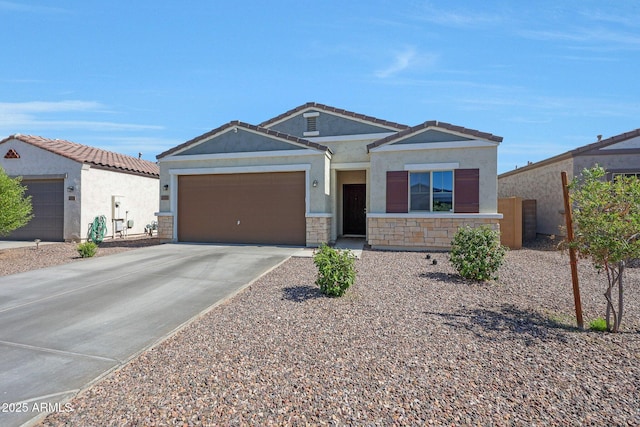 12731 W Myrtle Ave, Glendale, AZ 85307 - view of front facade with stucco siding, concrete driveway, a garage, stone siding, and a tile roof
