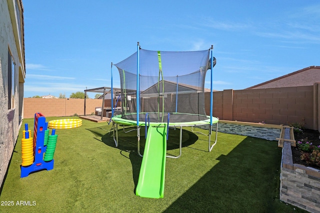 12731 W Myrtle Ave, Glendale, AZ 85307 - view of play area with a trampoline and a fenced backyard