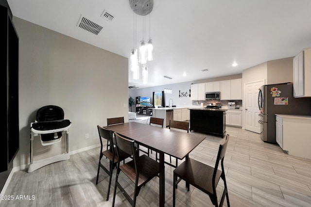 12731 W Myrtle Ave, Glendale, AZ 85307 - dining space featuring recessed lighting and light wood-style flooring