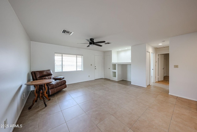 sitting room with light tile patterned floors, ceiling fan, baseboards, and recessed lighting
