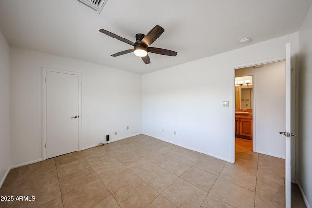 unfurnished bedroom with light tile patterned floors and a ceiling fan