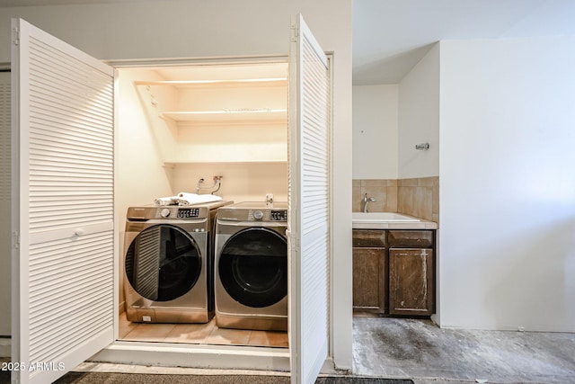 laundry area featuring washing machine and clothes dryer