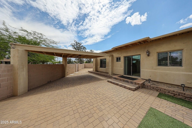 view of patio featuring fence
