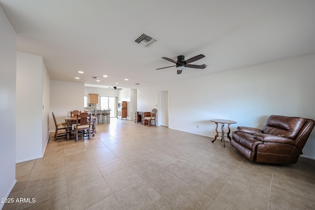 sitting room featuring ceiling fan, recessed lighting, light tile patterned floors, and baseboards