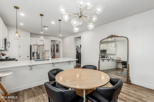 dining room with recessed lighting, visible vents, baseboards, and light wood finished floors