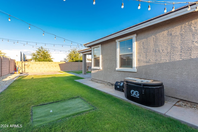 view of yard with a patio area and a fenced backyard