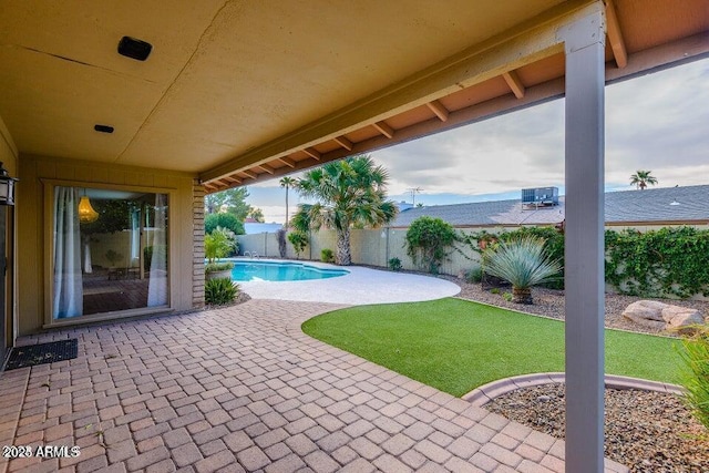 view of swimming pool with a patio area