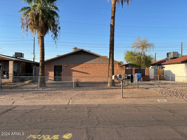 single story home with central air condition unit