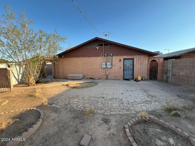 back of property featuring a patio area