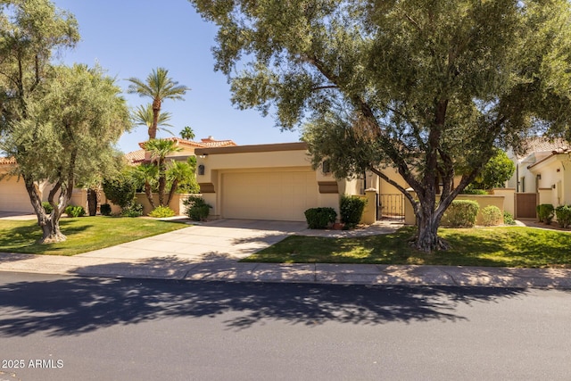 10429 N 101st St, Scottsdale, AZ 85258 - view of front of house with a garage, driveway, a tile roof, stucco siding, and a gate