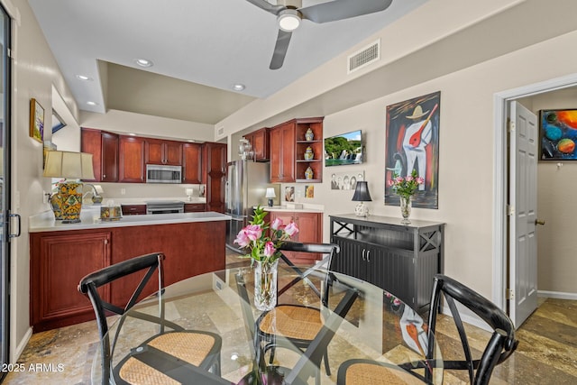 10429 N 101st St, Scottsdale, AZ 85258 - dining space with stone finish floors, ceiling fan, recessed lighting, and baseboards