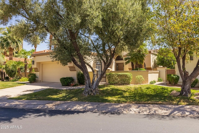10429 N 101st St, Scottsdale, AZ 85258 - view of front facade featuring concrete driveway, stucco siding, a tiled roof, and a garage
