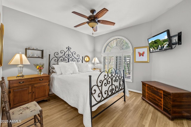10429 N 101st St, Scottsdale, AZ 85258 - bedroom featuring light wood-type flooring, baseboards, and ceiling fan