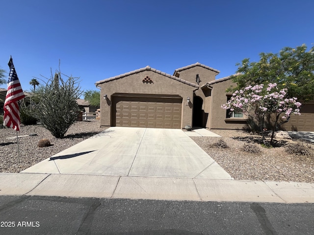 5754 N Aztec Dr, Eloy, AZ 85131 - view of front facade with stucco siding, a garage, and concrete driveway