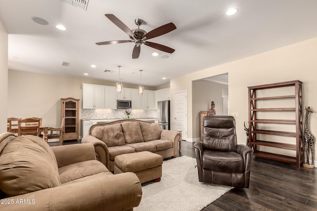 5754 N Aztec Dr, Eloy, AZ 85131 - living room with a ceiling fan, recessed lighting, and dark wood-style floors