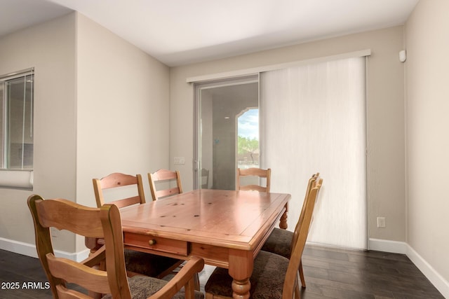 5754 N Aztec Dr, Eloy, AZ 85131 - dining area featuring baseboards and dark wood-style flooring