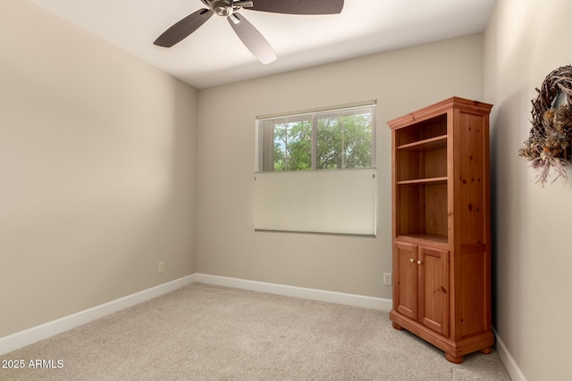 5754 N Aztec Dr, Eloy, AZ 85131 - spare room with a ceiling fan, light carpet, and baseboards
