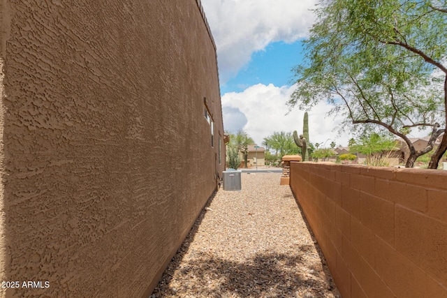 5754 N Aztec Dr, Eloy, AZ 85131 - view of side of property with stucco siding and cooling unit