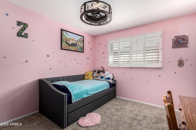 bedroom featuring baseboards and carpet floors