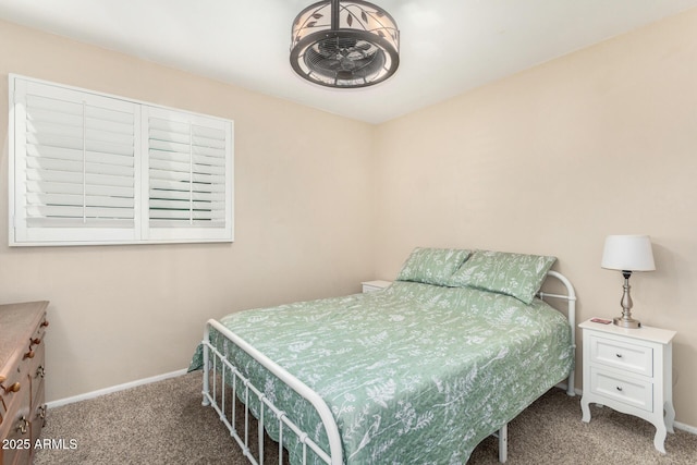 bedroom featuring baseboards and carpet floors