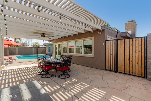 view of patio / terrace with outdoor dining space, a fenced in pool, fence, and a pergola