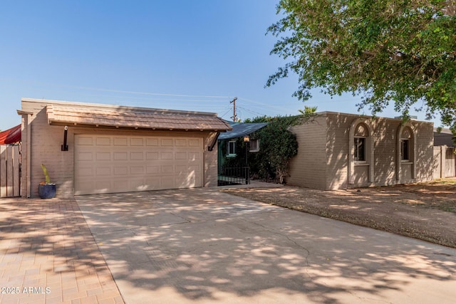 view of front of property featuring concrete driveway