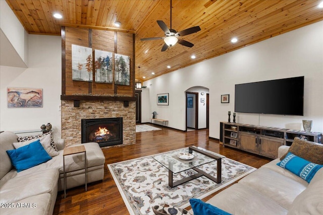 living room with dark hardwood / wood-style floors, high vaulted ceiling, and wooden ceiling