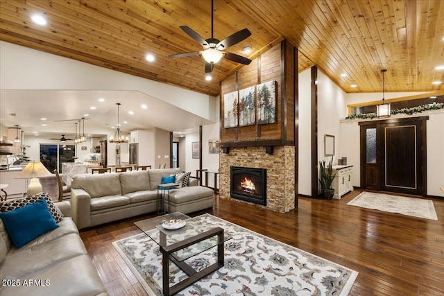 living room with dark hardwood / wood-style flooring, high vaulted ceiling, a fireplace, and wooden ceiling