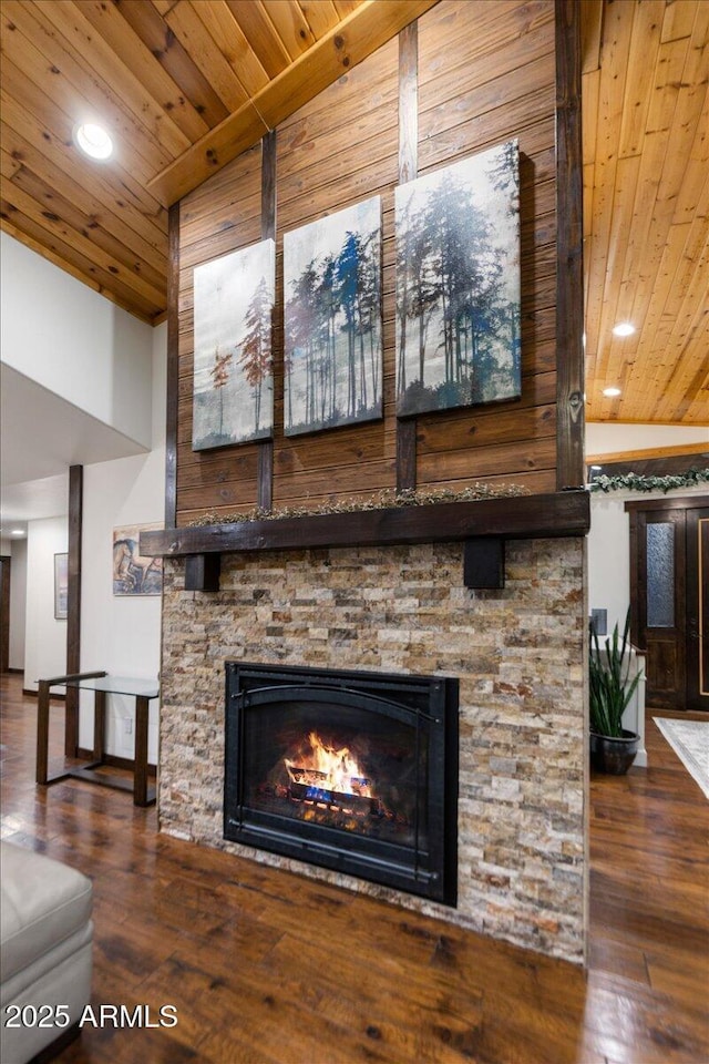 room details featuring hardwood / wood-style flooring, wood ceiling, and a fireplace