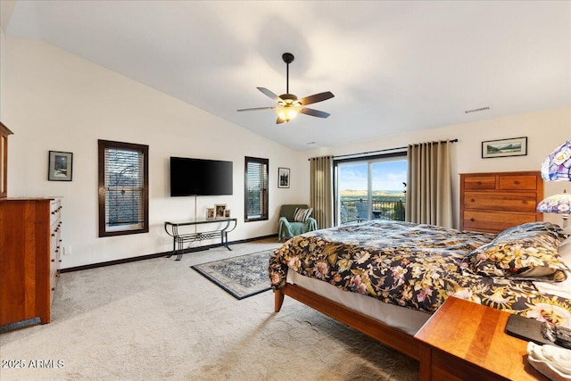 carpeted bedroom with ceiling fan, access to exterior, and vaulted ceiling