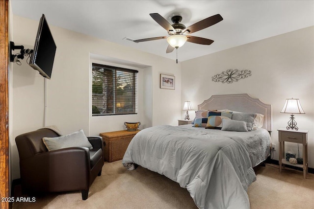 bedroom featuring ceiling fan and light colored carpet