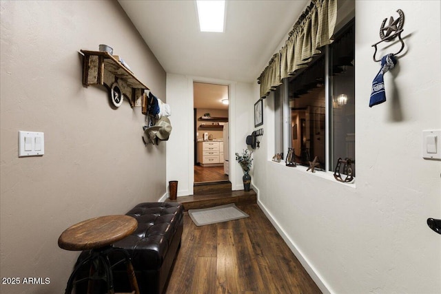 hallway with wood-type flooring