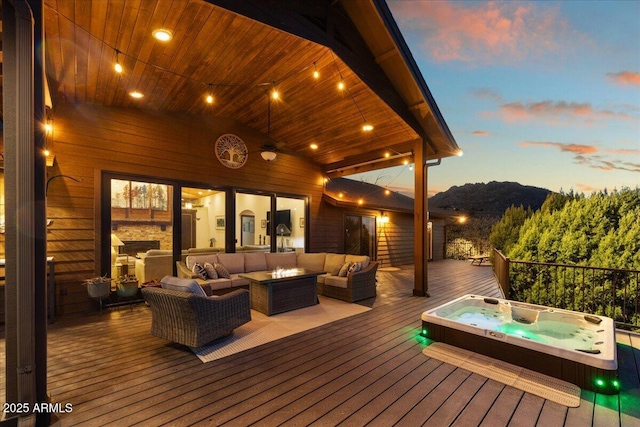 deck at dusk with an outdoor living space