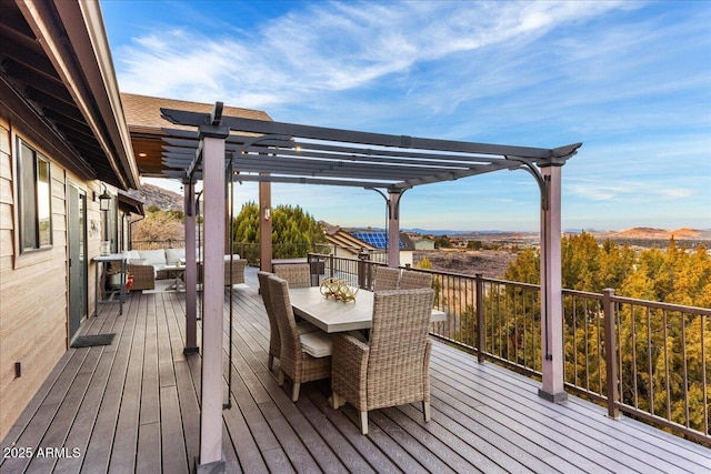 wooden terrace featuring outdoor lounge area and a pergola