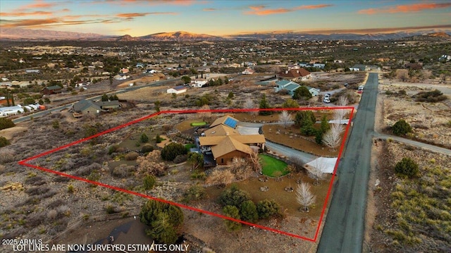 aerial view at dusk with a mountain view