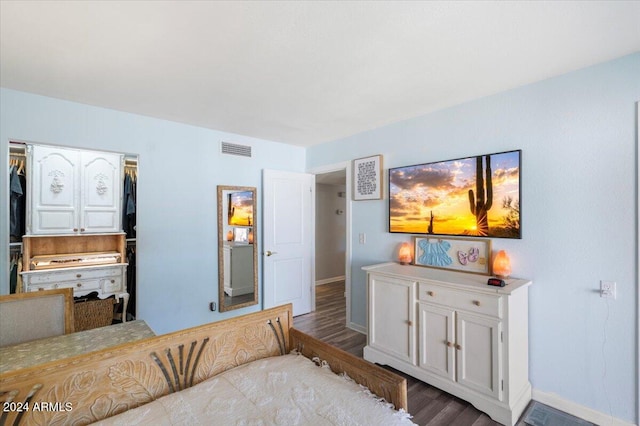 bedroom with a closet and light hardwood / wood-style flooring