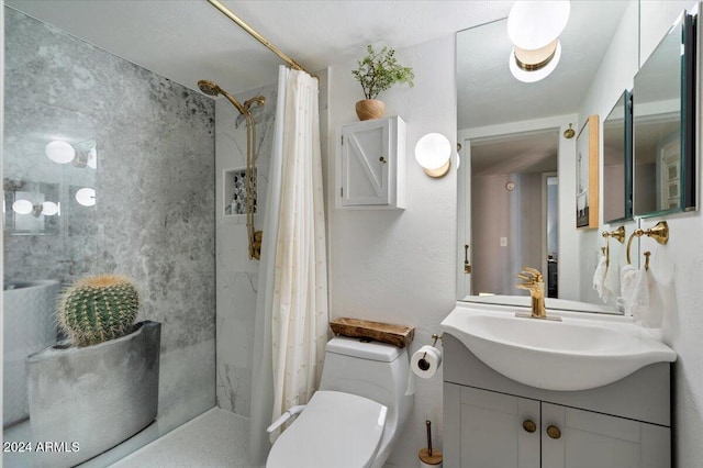 bathroom with vanity, curtained shower, and toilet