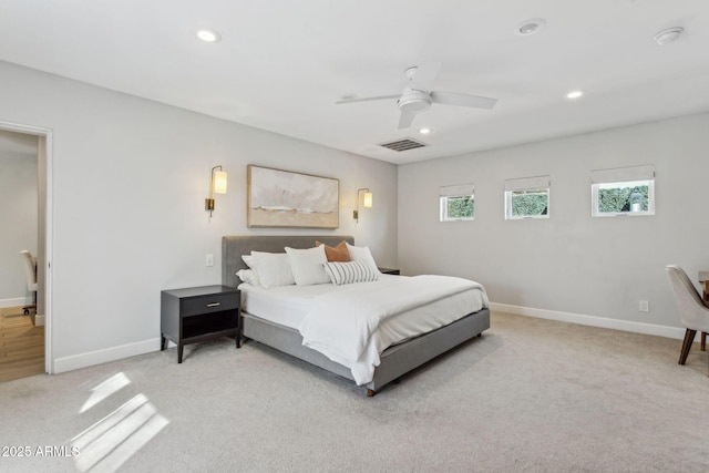 bedroom with light carpet, recessed lighting, visible vents, and baseboards