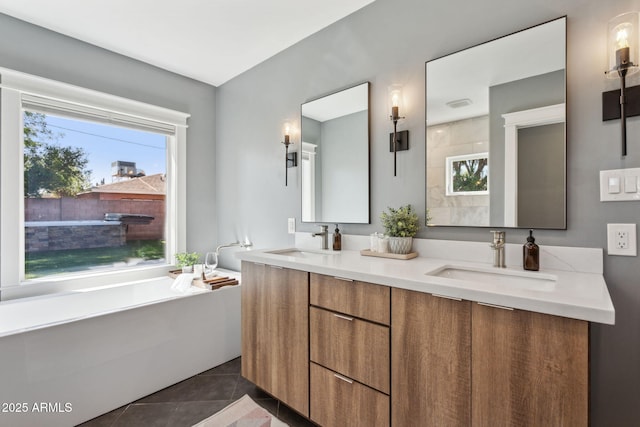 full bathroom with a sink, a bathtub, double vanity, and tile patterned flooring