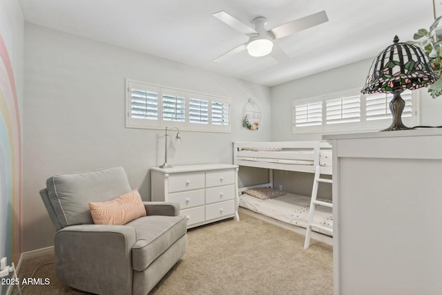 bedroom with carpet and a ceiling fan