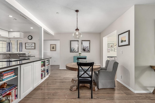 3420 N Kachina Ln, Scottsdale, AZ 85251 - dining area with baseboards, wood finished floors, and recessed lighting
